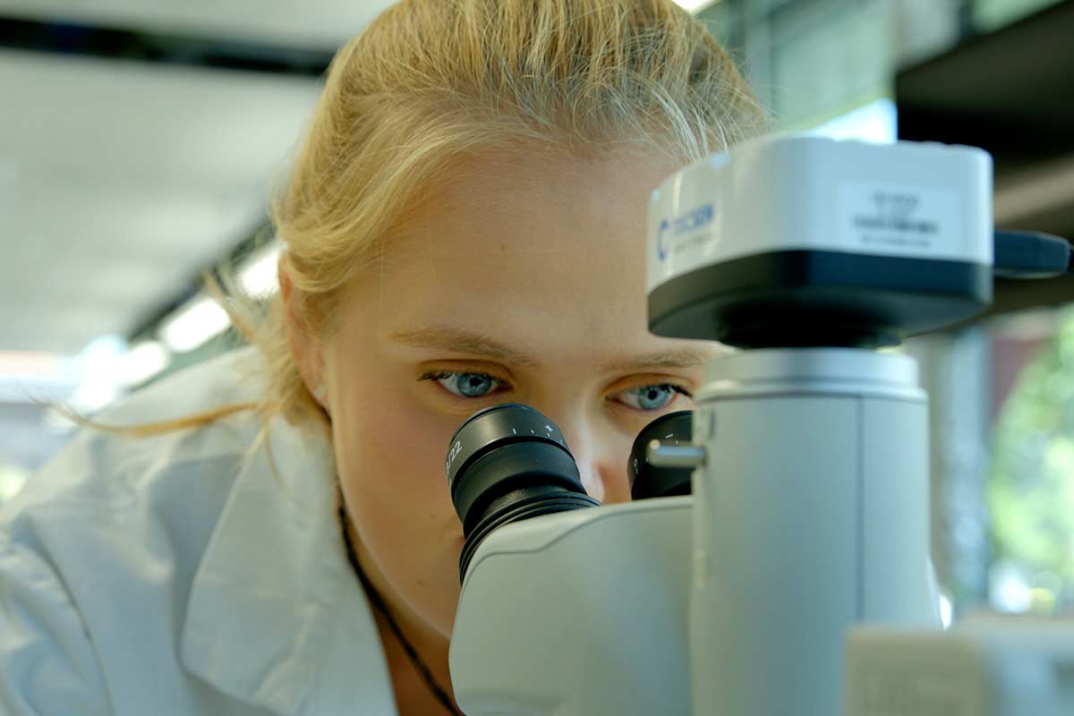 Header Female Scientist Research